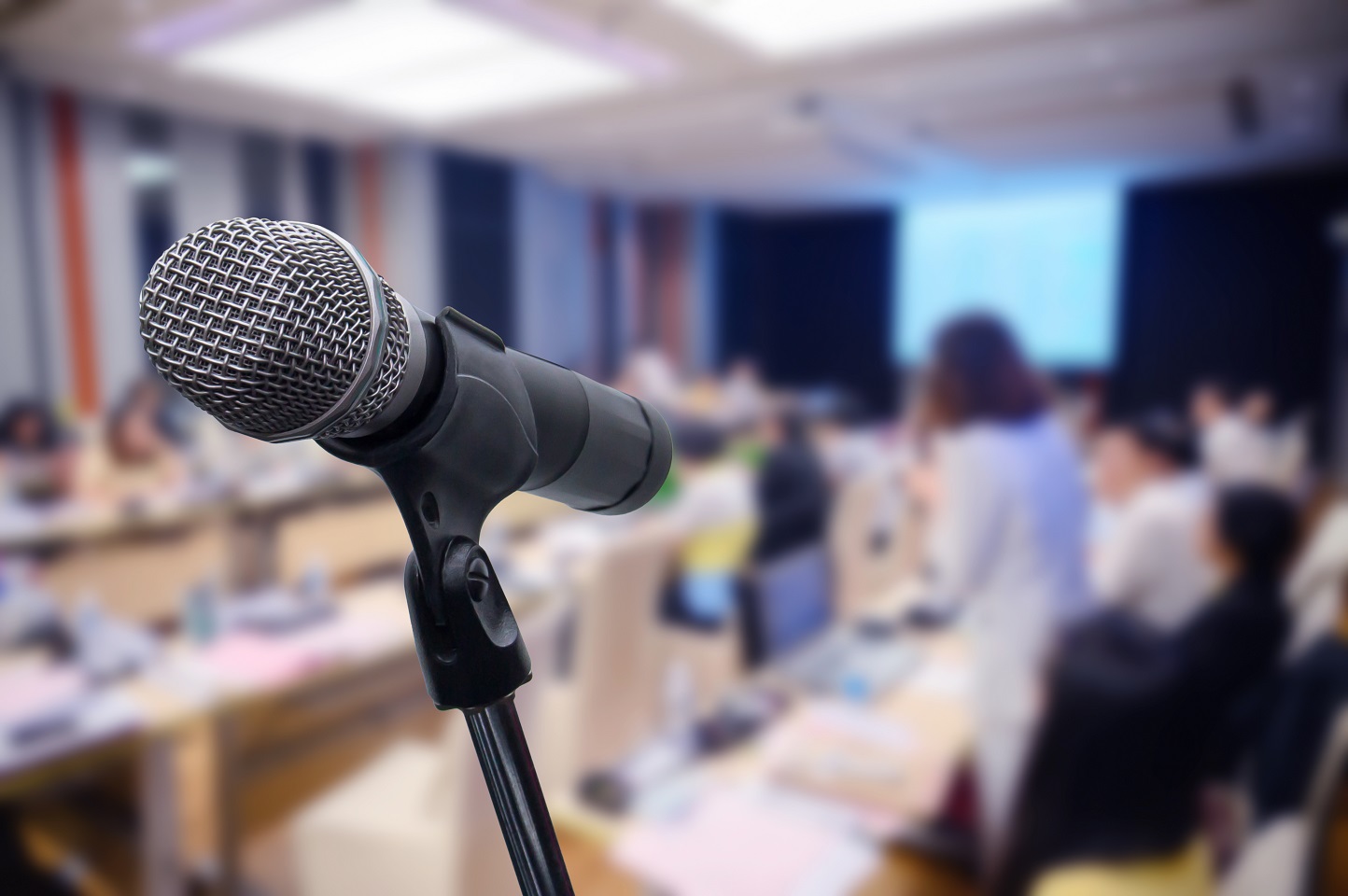 Microphone over the blurred business forum Meeting or Conference